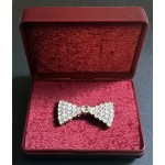Silver colour 'diamond' studded brooch bow design ...