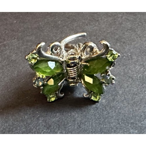 Green butterfly design clip fixing brooch set in silver coloured mount