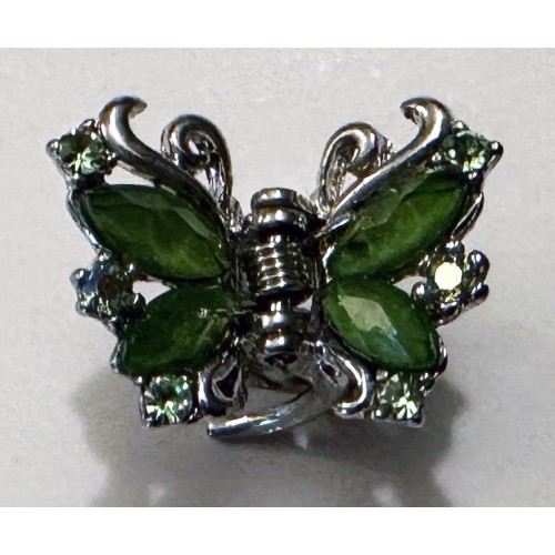 Green butterfly design clip fixing brooch set in silver coloured mount